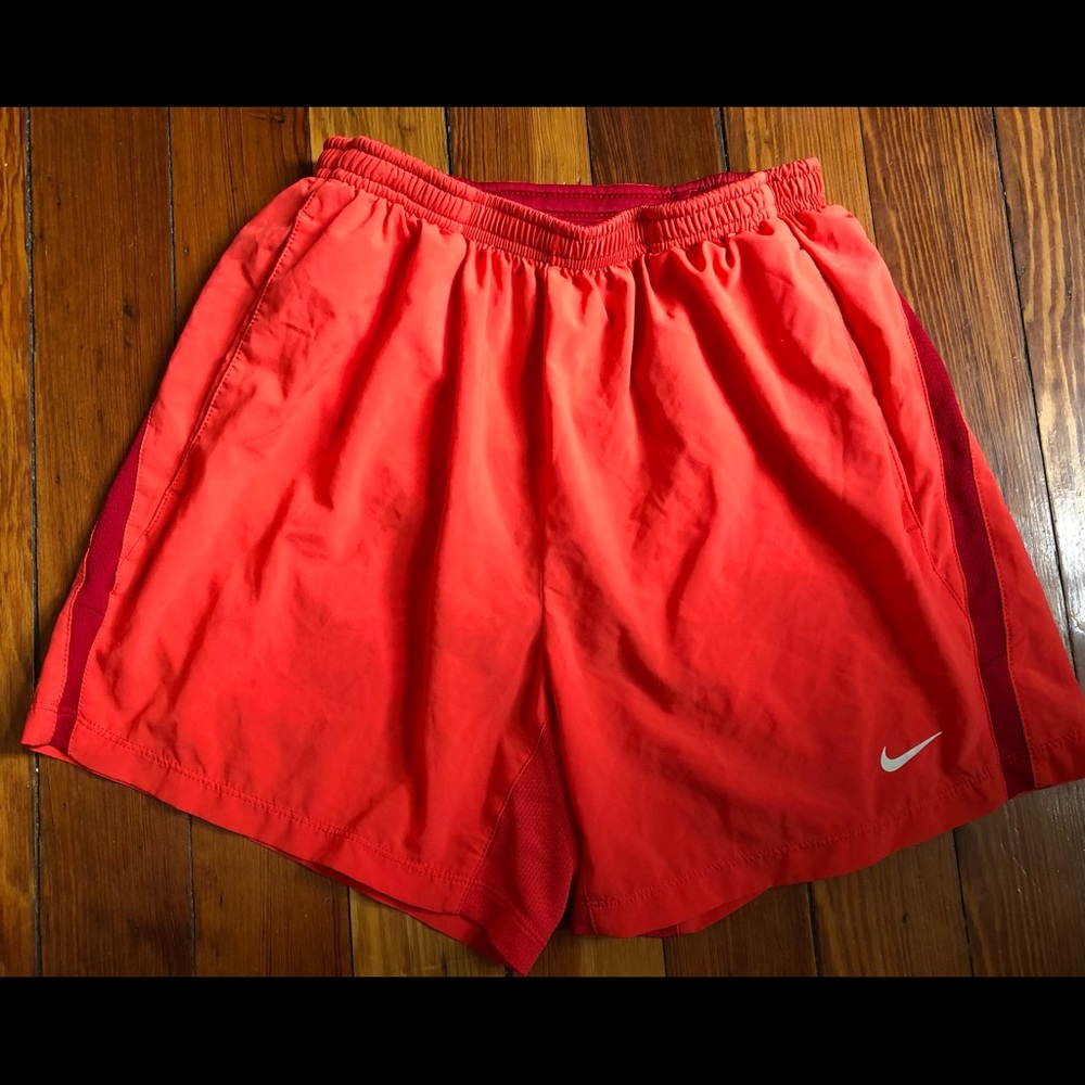 Red Nike running shorts (3” inseam)